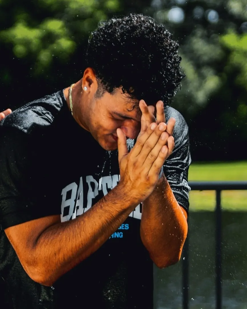 A post from Baptism Sunday: a man overcome, hands to his face