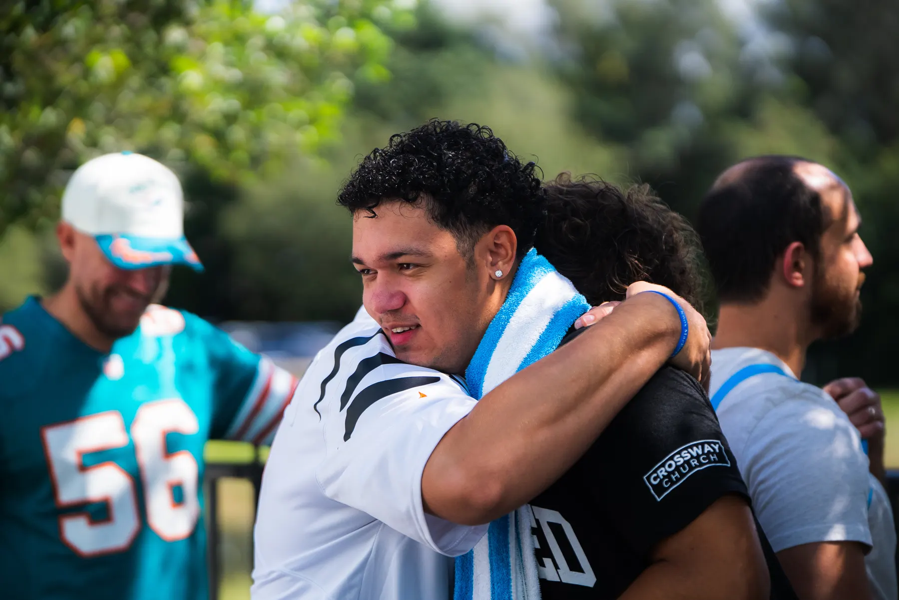 Two men embracing after a baptism
