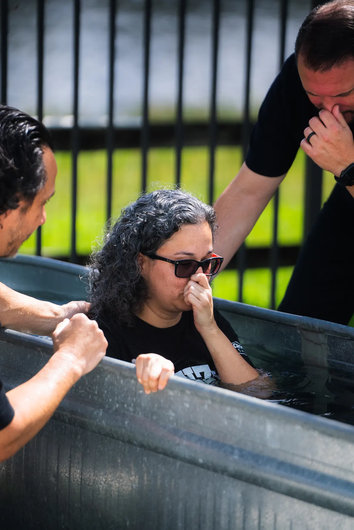 A woman in tears at the edge of the tank