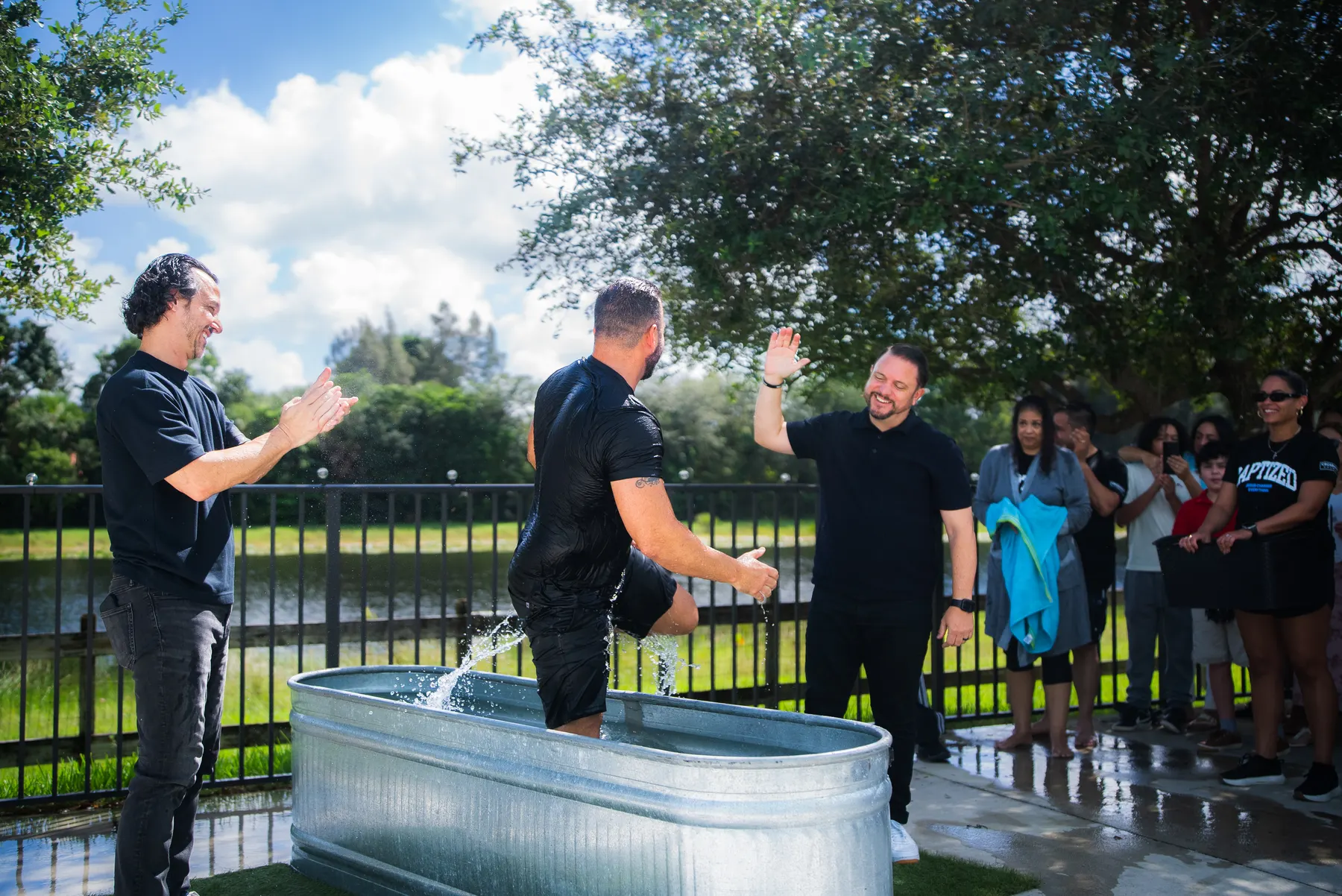 The church watching from around the baptism tank